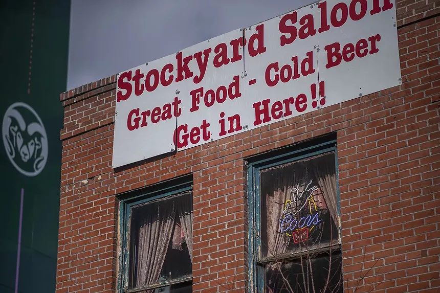 outside of old bar with sign in front