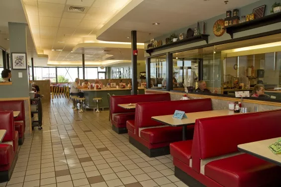 red booths inside a restaurant