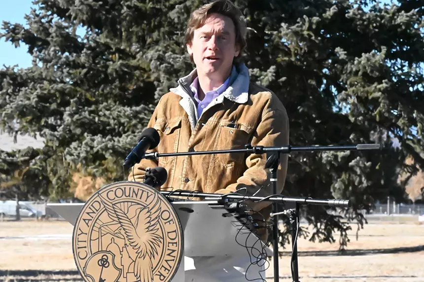 Man speaks at podium