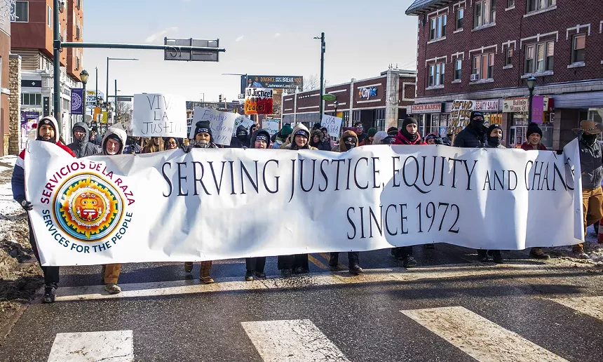 marchers with banner