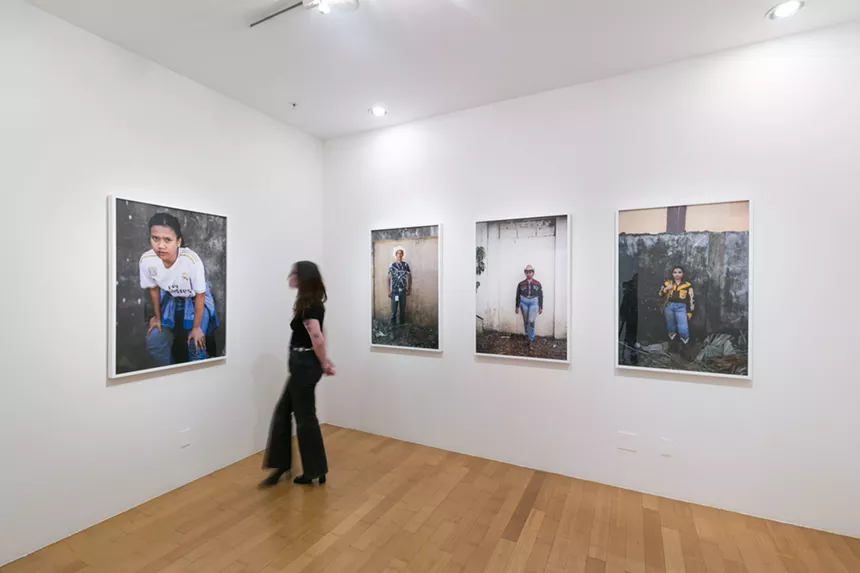 woman looking at photos in gallery