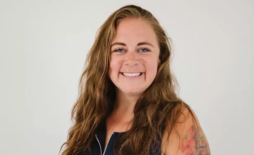 smiling woman with long brown hair
