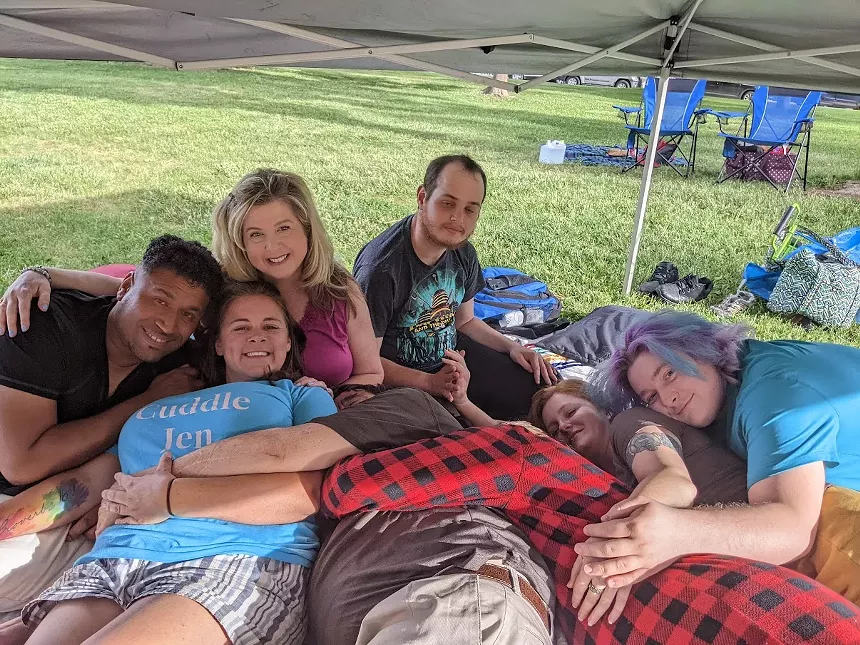 people cuddling outside.