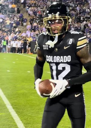 Travis Hunter warms up at CU