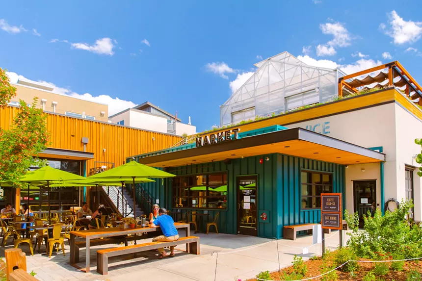 exterior of a teal and yellow building