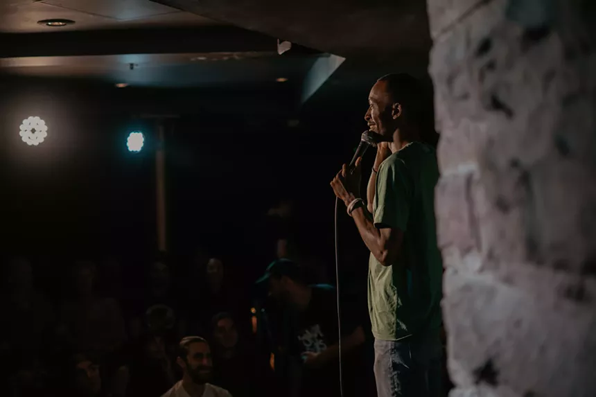 A man performs onstage.