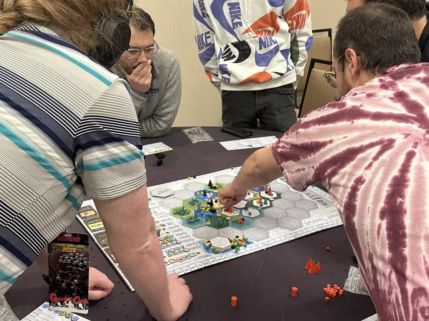 People play a board game