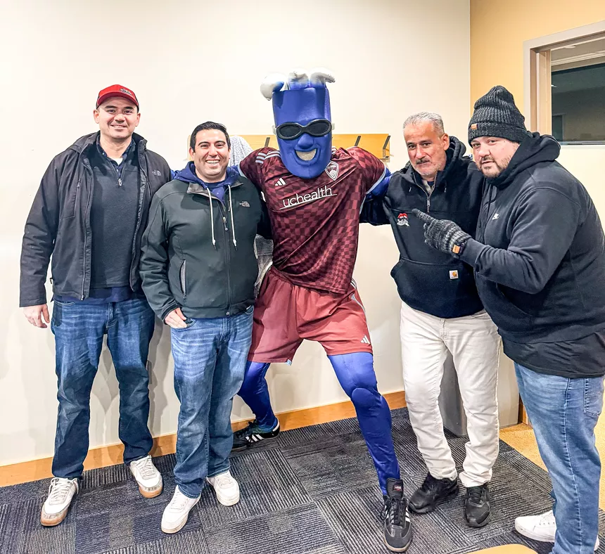 four men posing with RapidMan