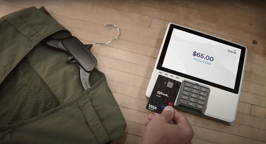 Someone paying with a visa card