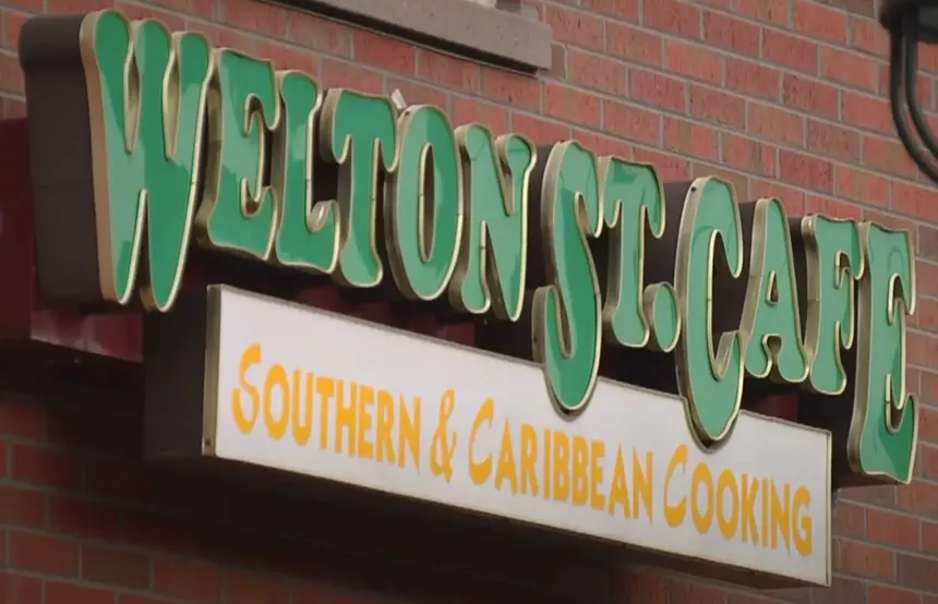A sign with green letters
