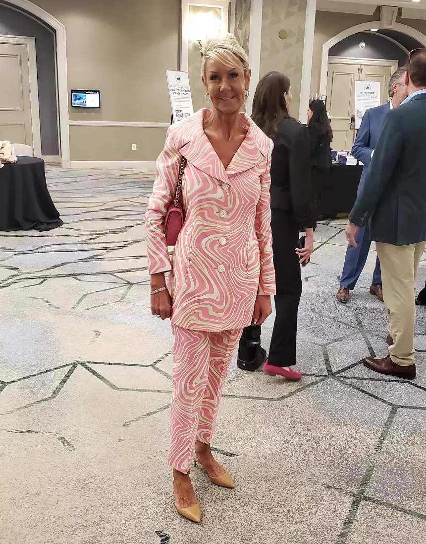 A woman in a pink outfit