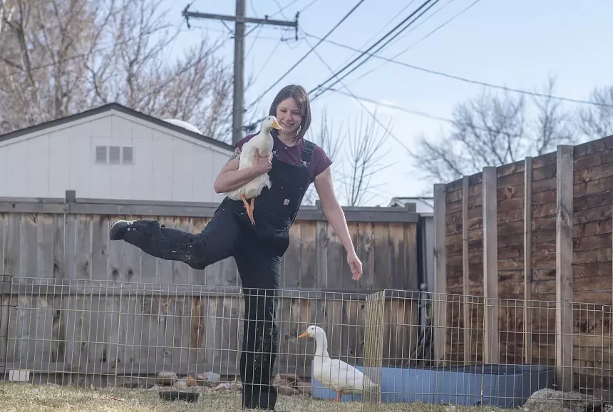woman with leg up, duck