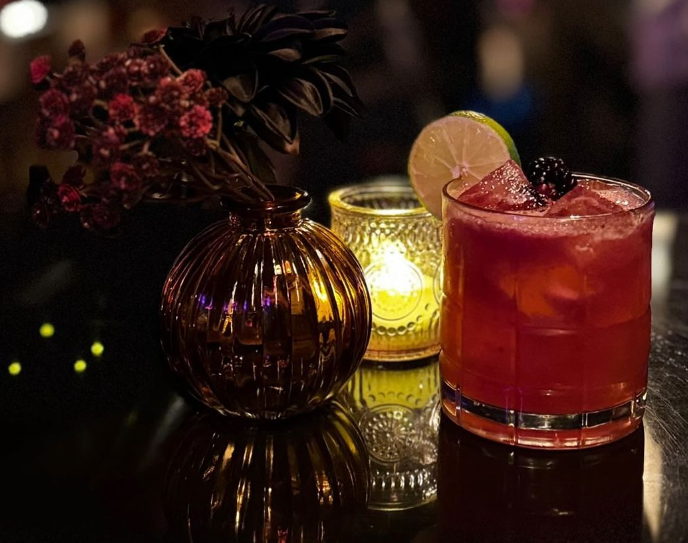 Drinks and a candle on a table