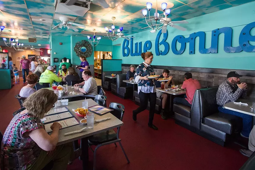 people at booths in a restaurant