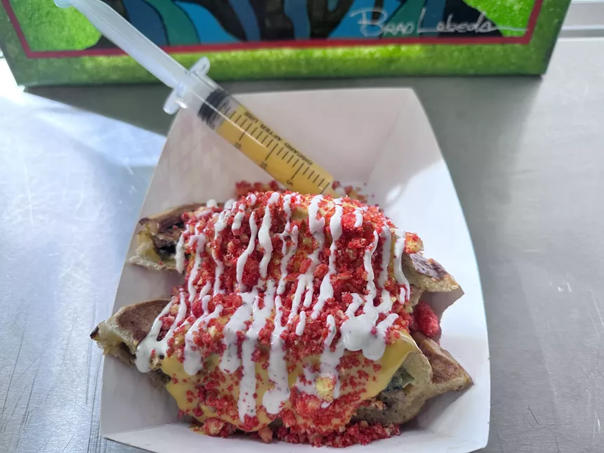 Burger smothered in cheese sauce, flamin’ hot Cheeto dust and a drizzle of ranch