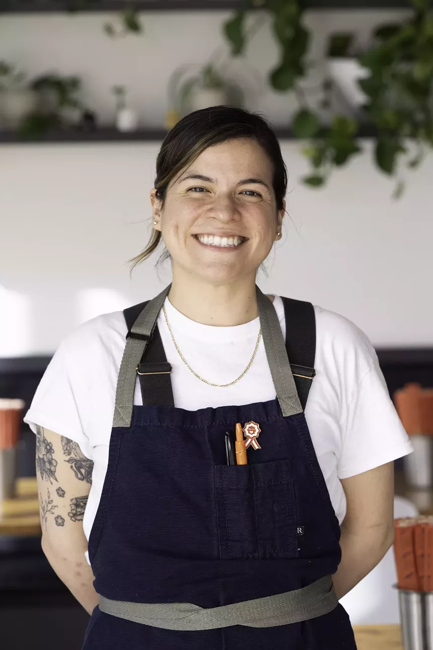 woman in a blue apron