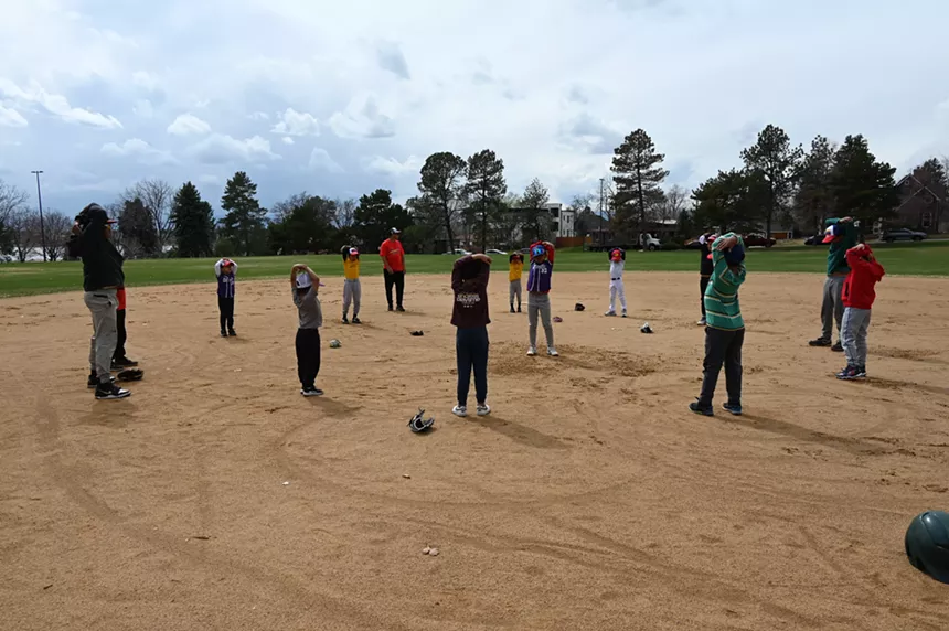 A group of kids stretches.