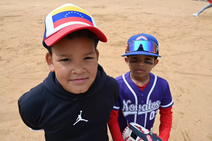Two boys smile.