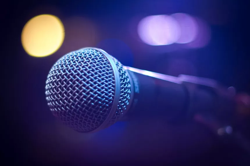 A microphone with lights around it