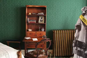 An old desk in a green room