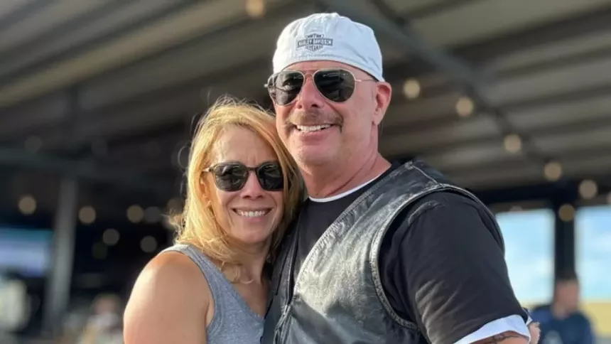 a wife and husband smiling