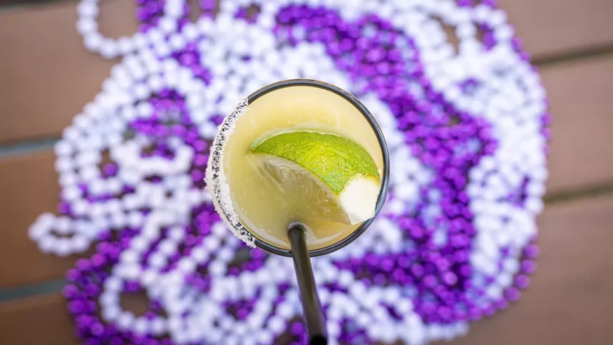 margarita surrounded by purple and white beads