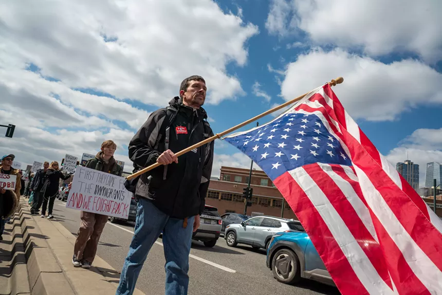 protester with upside-down flag