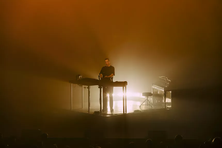Ben Böhmer lit against a backlight fog.