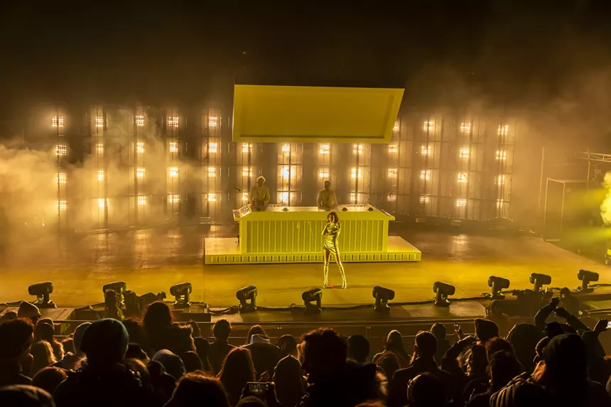 A photo showing the Red Rocks crowd and Polo Fan performing on stage.