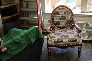 A fabric and gold chair