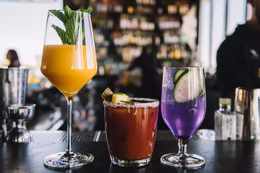 A mimosa, Bloody Mary and "forbidden juice" mocktail from El Five