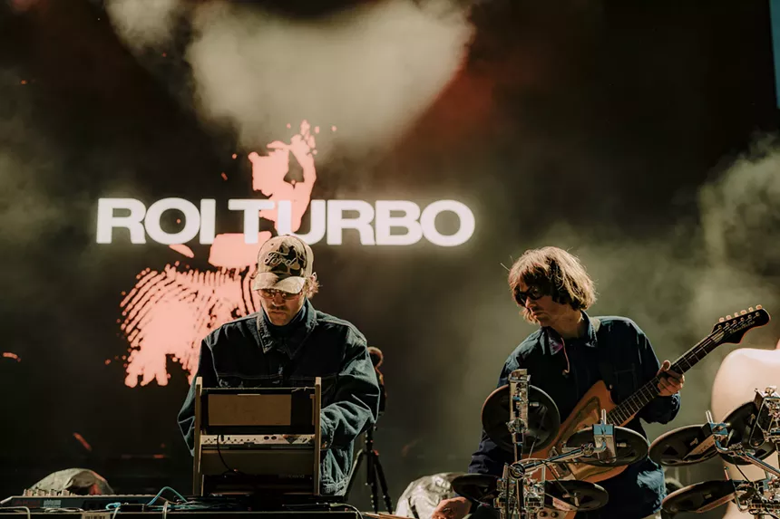 Roi Turbo performing on stage at Red Rocks.