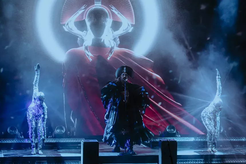 Empire of the Sun on stage at Red Rocks with performers and stage visuals.