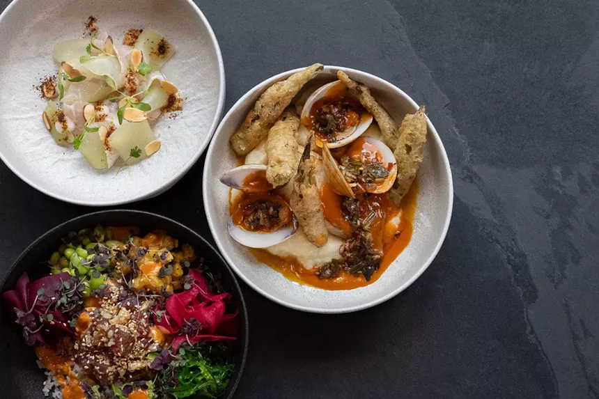 Three seasonal dishes from Sweet Basil, including a poke bowl and clam entree