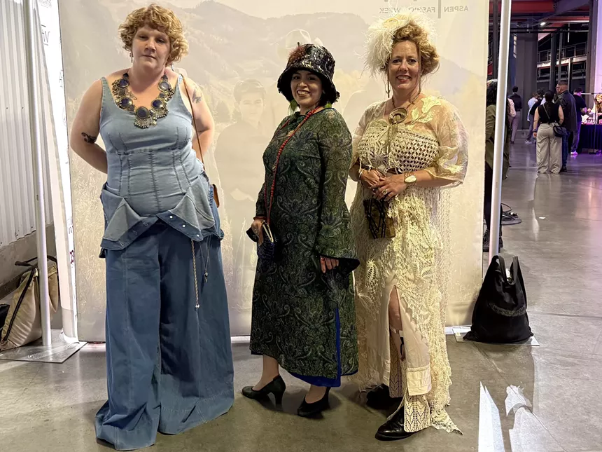 Three women in unique outfits