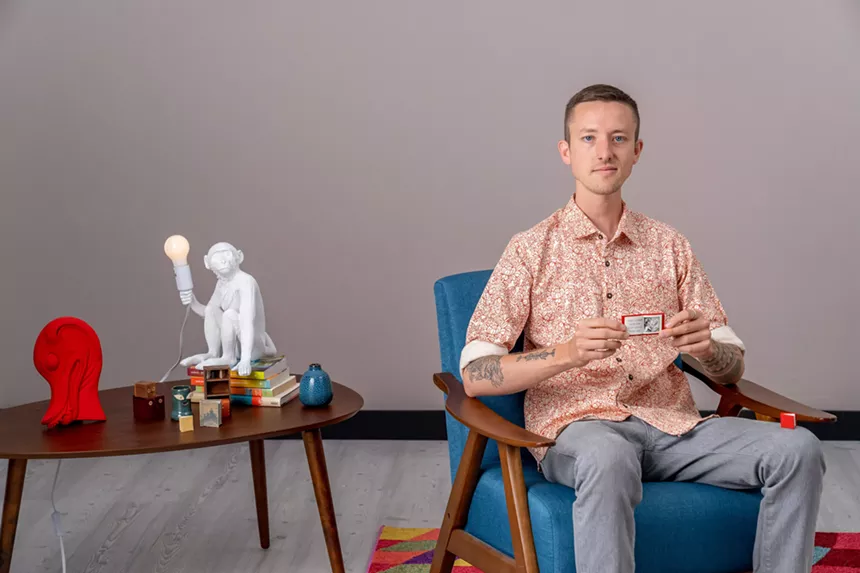 A man sits in a chair
