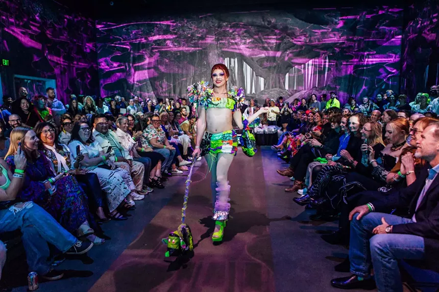 a model walks a runway