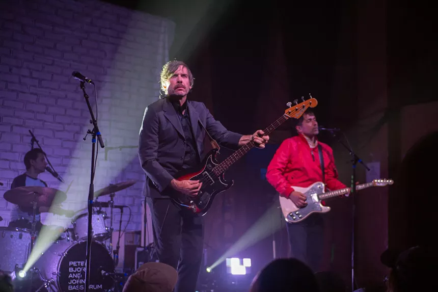 Band members playing on-stage