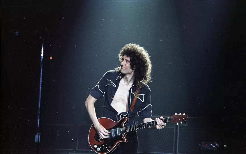 Brian May playing guitar in 1982.