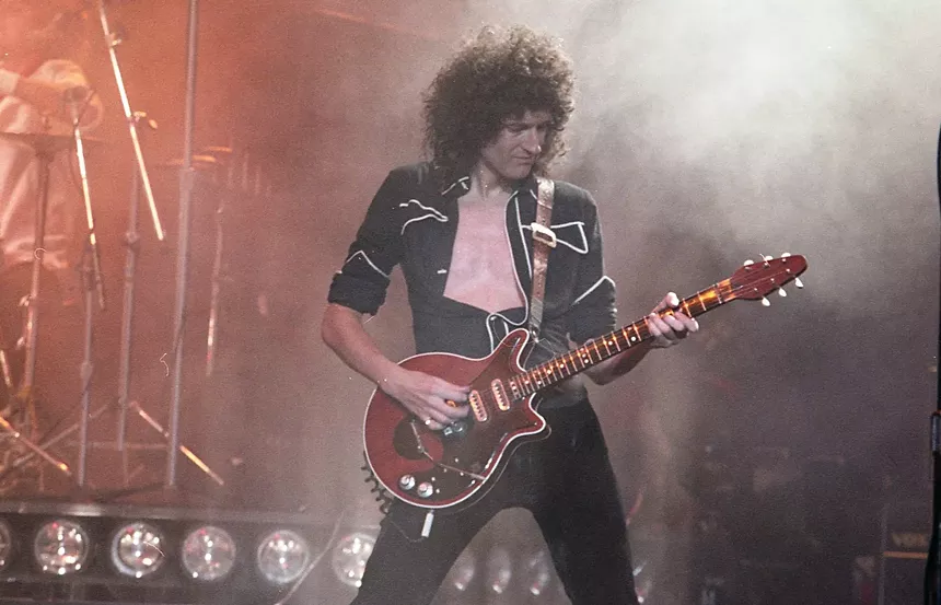 Brian May playing guitar in 1982.