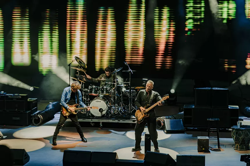 Sting performing on stage at Red Rocks.