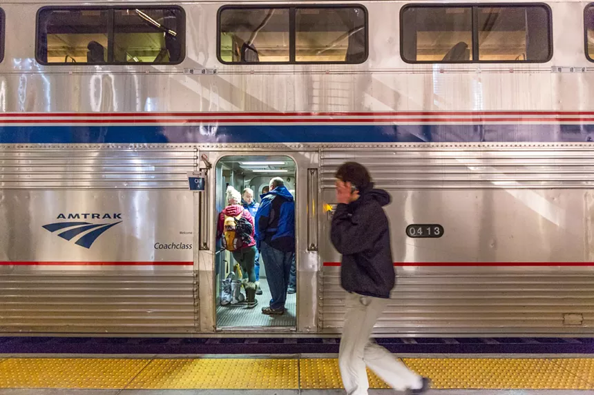 People board a train