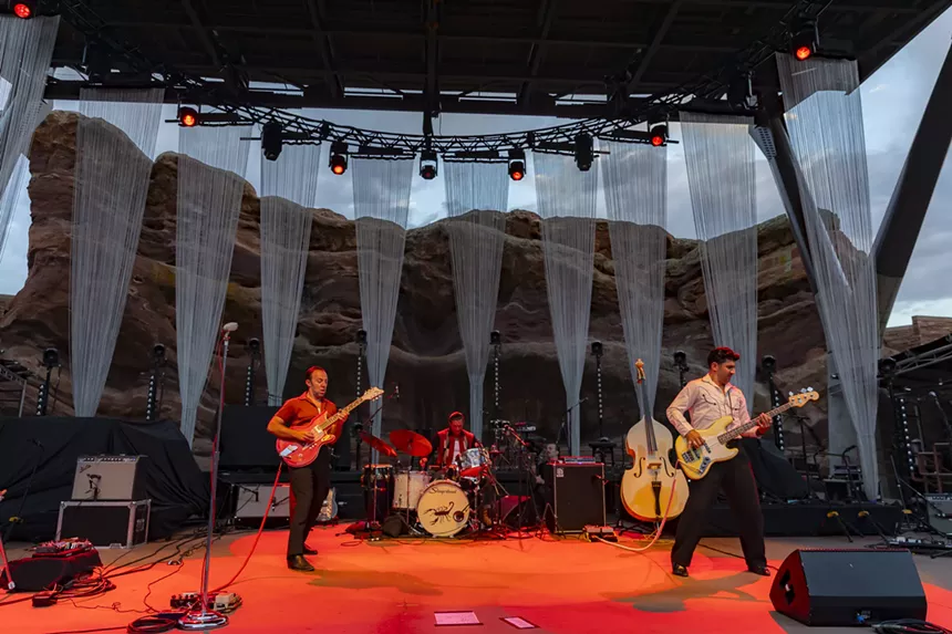 LA LOM performing on stage at Red Rocks.