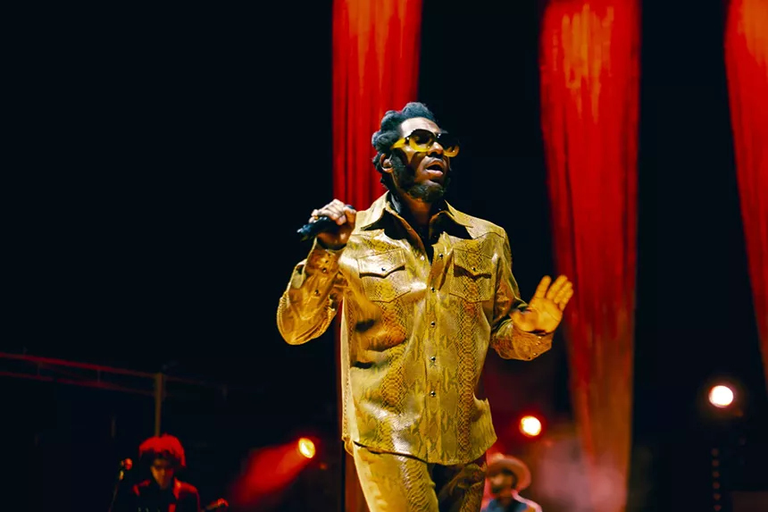 Leon Bridges dancing on stage at Red Rocks.