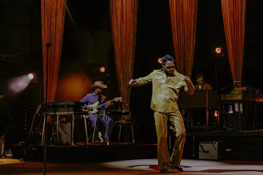 Leon Bridges dancing on stage at Red Rocks.