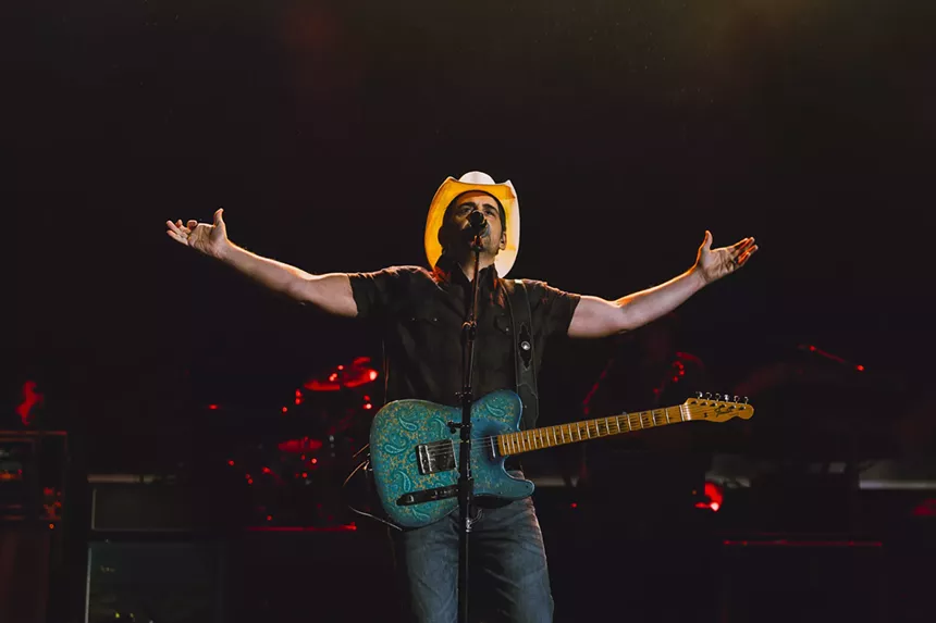 Brad Paisley, with his hands up, taking in the crowd at Red Rocks.
