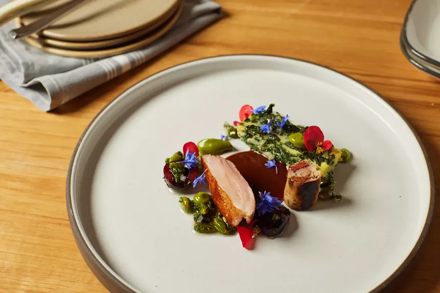 A duck dish from Rootstalk garnished with edible flowers