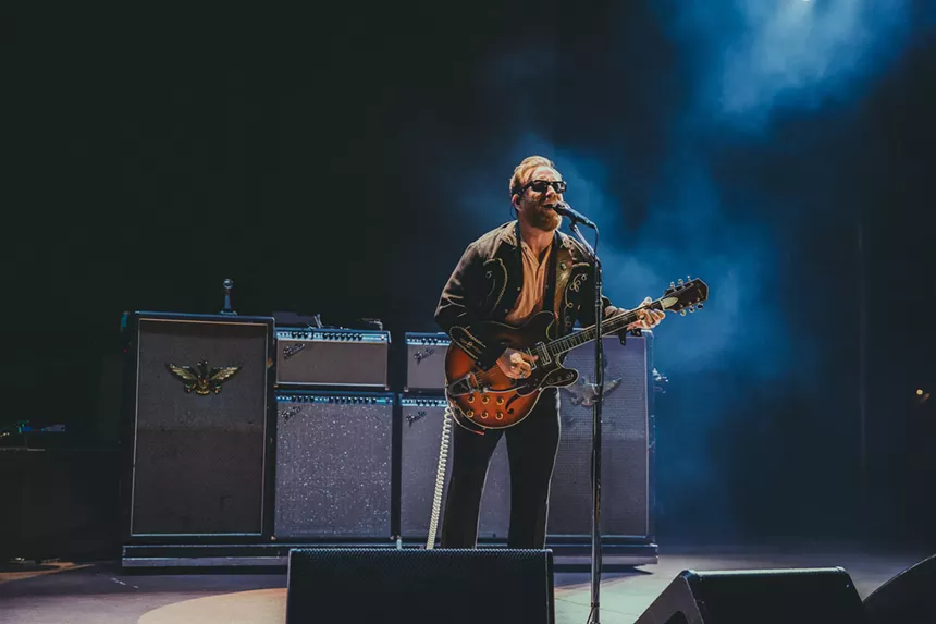 Dan Auerbach, of The Black Keys, performing on stage at Red Rocks.