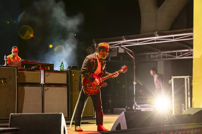 Dan Auerbach, of The Black Keys, performing on stage at Red Rocks.