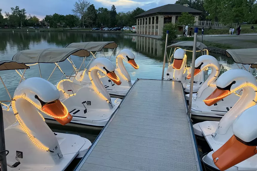 Swan boats docked along Smith Lake in Wash Park